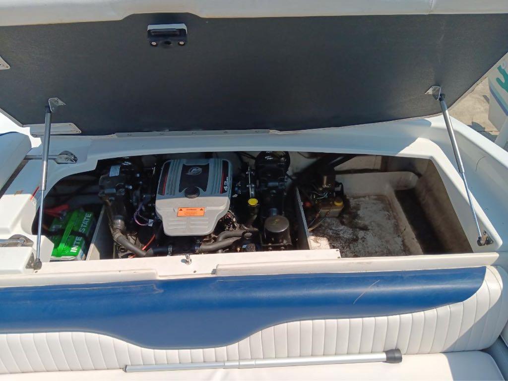 Slide: The Image of 2012 Crownline 21SS boat engine compartment with open hatch. - 2