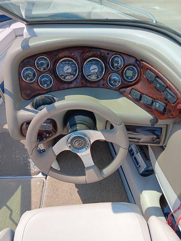 Slide: The Image of 2012 Crownline 21SS boat dashboard with steering wheel and instrument panel. - 6