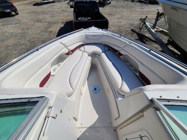 Slide: The Image of 2003 Crownline 230BR boat interior with white and red seating. - 8
