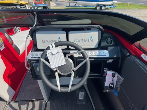 Slide: The Image of 2023 Crownline 240 SS boat dashboard with Garmin navigation system. - 1