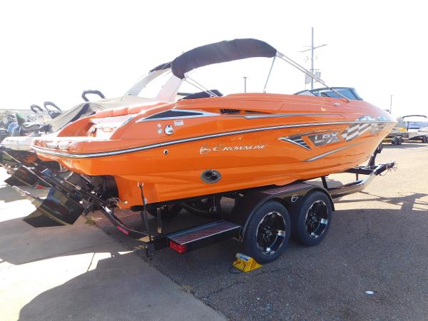 Slide: The Image of 2024 Crownline 240 SS LPX boat in vibrant orange on a trailer. - 1