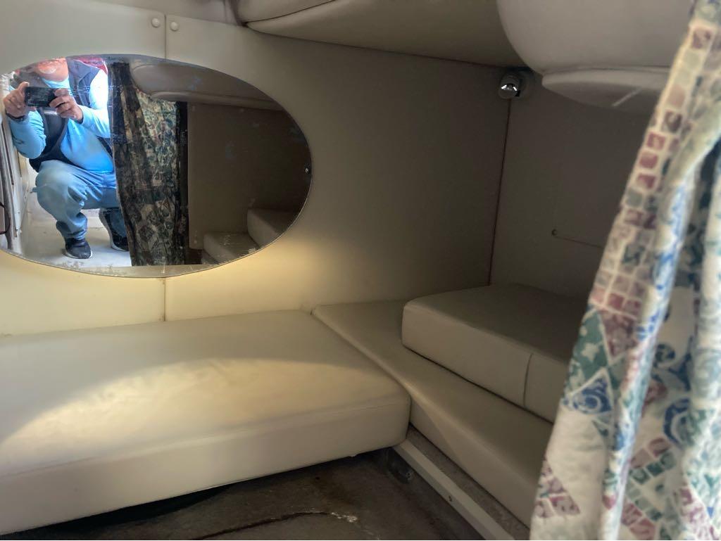 Slide: The Image of Interior cabin of a 2000 Crownline 268 boat with seating and mirror. - 15