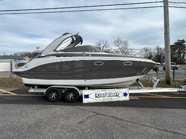 Slide: The Image of 2024 Crownline 270 CR boat on trailer at dealership. - 1