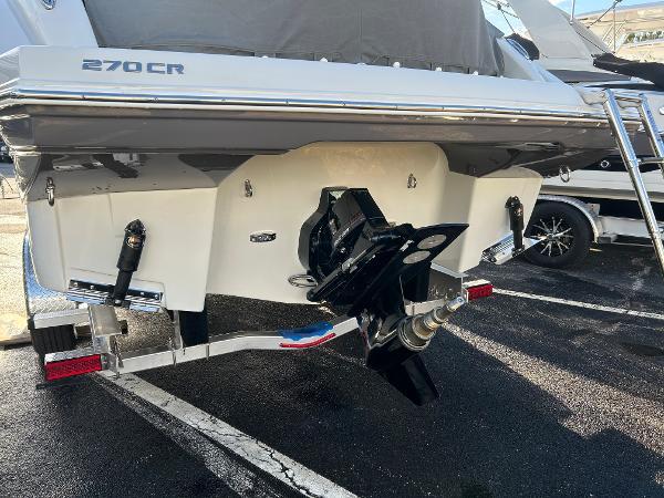 Slide: The Image of 2024 Crownline 270 CR boat stern view with outboard motor. - 3