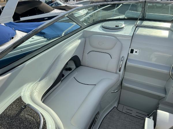 Slide: The Image of 2024 Crownline 270 CR boat interior with white seating and modern design. - 7