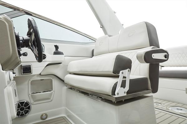 Slide: The Image of 2024 Crownline 280 CRX boat interior with white and gray seating and steering wheel. - 11