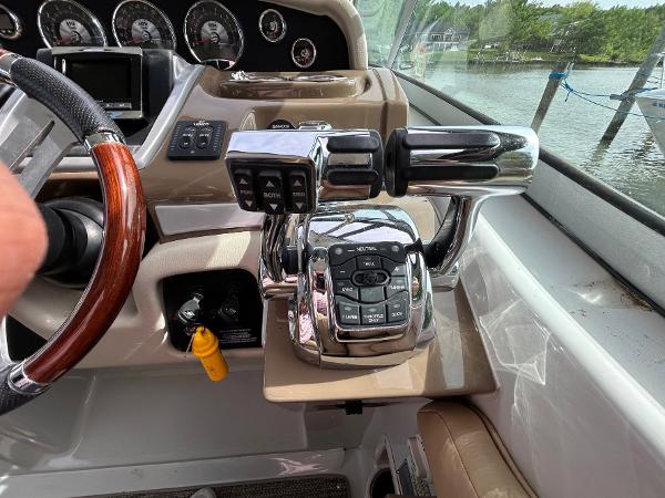 Slide: The Image of Control panel of a 2015 Crownline 350 SY boat with chrome throttle levers. - 15