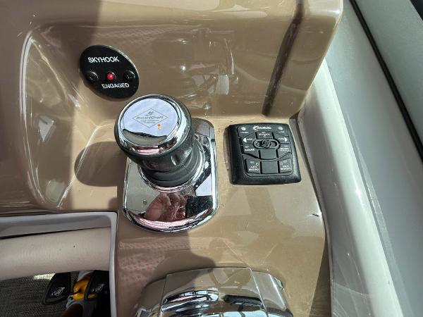 Slide: The Image of Control panel of a 2015 Crownline 350 SY boat with joystick and buttons. - 16
