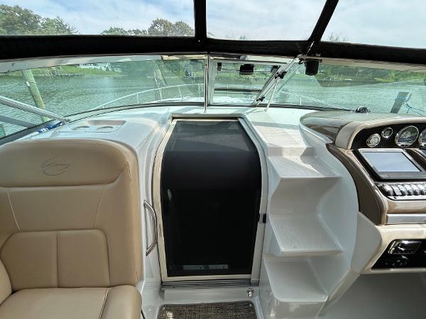 Slide: The Image of 2015 Crownline 350 SY yacht interior with helm, seating, and dashboard. - 21