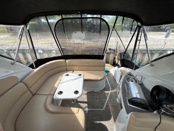 Slide: The Image of Interior of 2015 Crownline 350 SY boat with beige seating and table. - 26