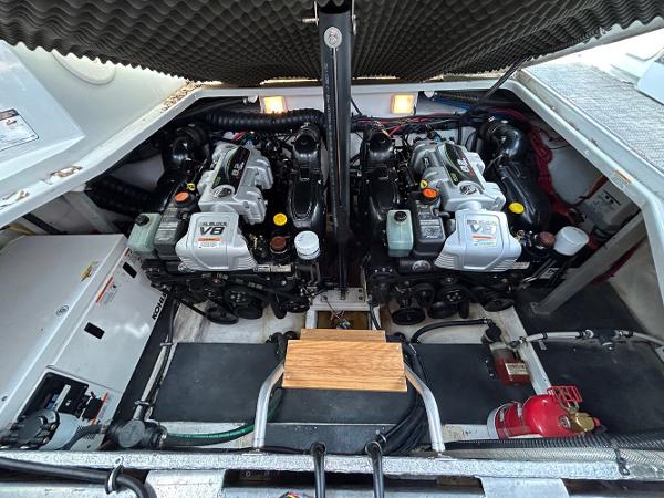 Slide: The Image of Engine compartment of a 2015 Crownline 350 SY boat with dual V8 engines. - 28