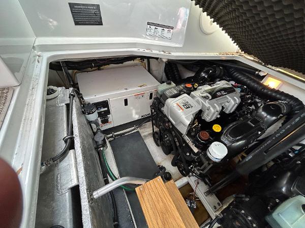 Slide: The Image of Engine compartment of a 2015 Crownline 350 SY boat, showcasing mechanical components. - 30