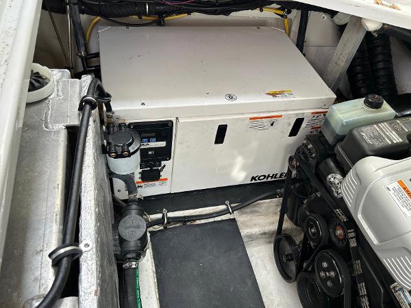 Slide: The Image of Engine compartment of 2015 Crownline 350 SY with Kohler generator visible. - 31