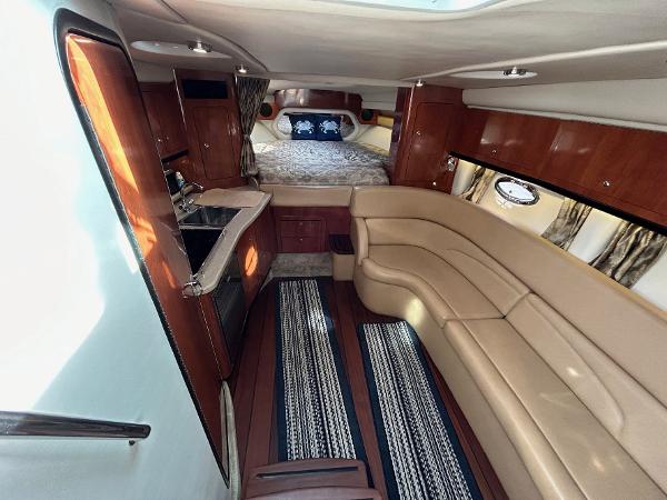 Slide: The Image of Luxurious interior of 2015 Crownline 350 SY yacht with leather seating and kitchenette. - 6