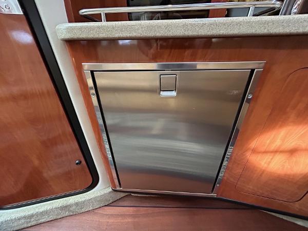 Slide: The Image of Stainless steel refrigerator in 2015 Crownline 350 SY yacht interior. - 9