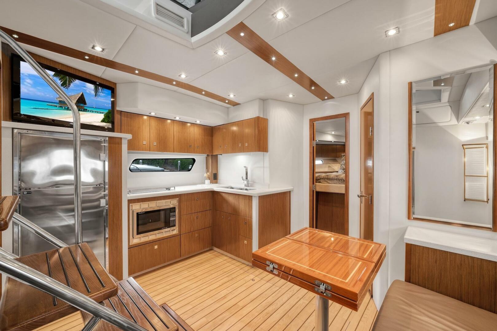 Slide: The Image of 2015 Cruisers Yachts 48 Cantius - Lower Galley & Dinette - 5117019