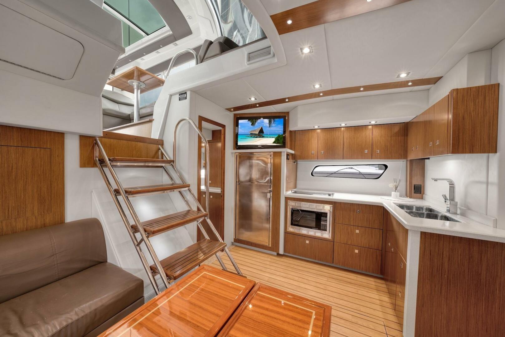 Slide: The Image of 2015 Cruisers Yachts 48 Cantius - Lower Galley & Dinette - 5117017