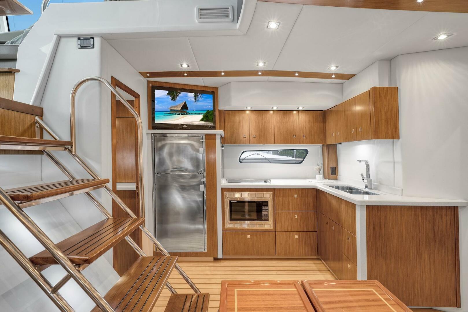 Slide: The Image of 2015 Cruisers Yachts 48 Cantius - Lower Galley & Dinette - 5117016