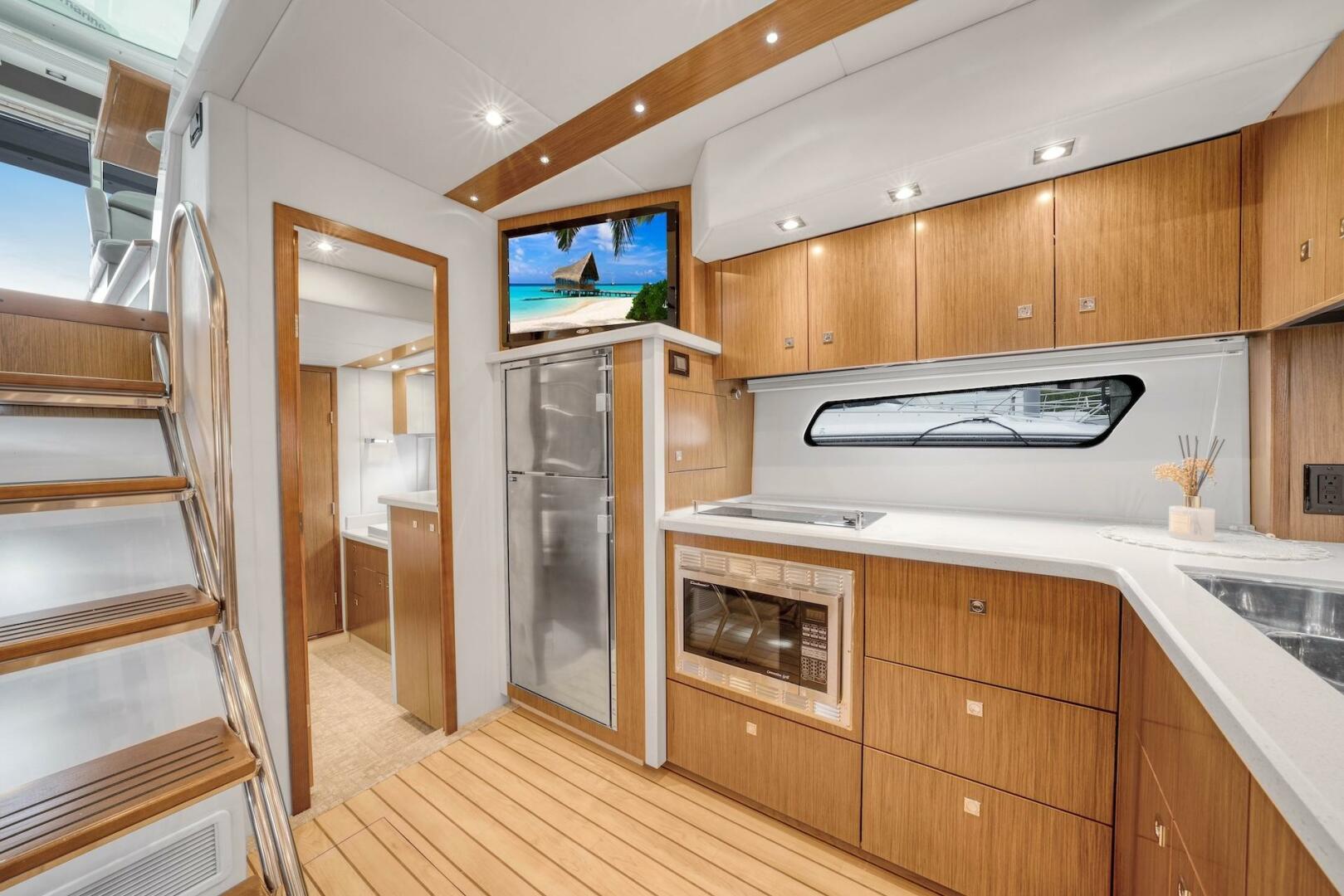 Slide: The Image of 2015 Cruisers Yachts 48 Cantius - Lower Galley & Dinette - 5117011