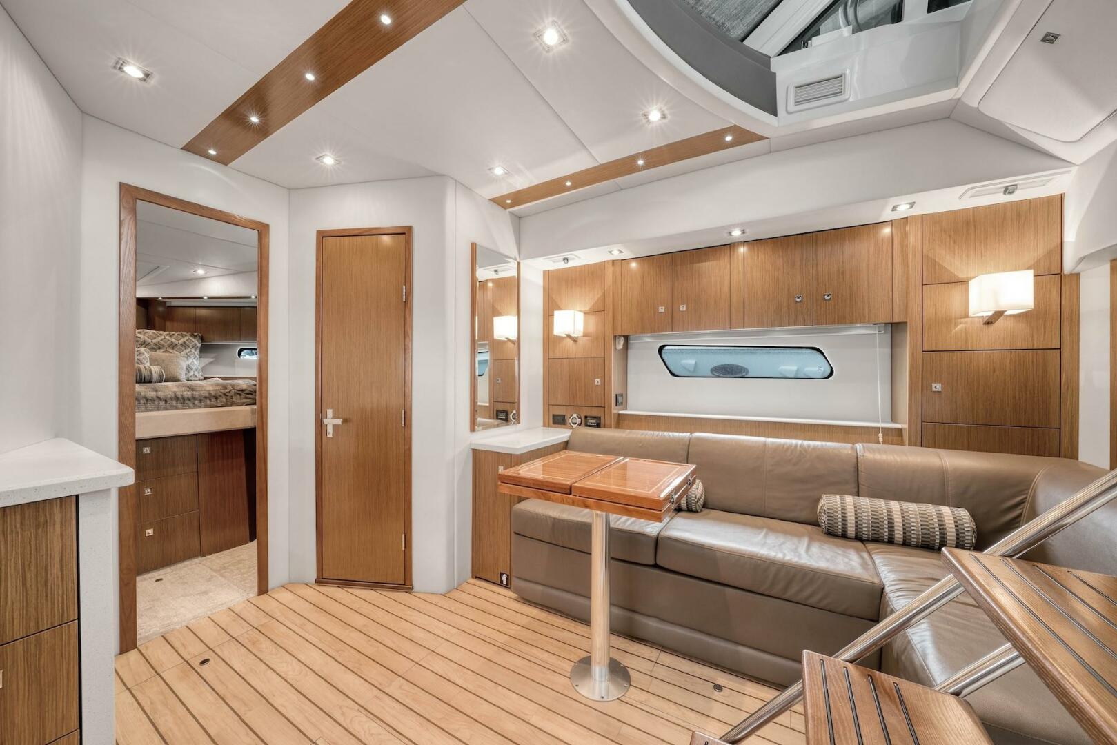 Slide: The Image of 2015 Cruisers Yachts 48 Cantius - Lower Dinette and stairs to helm - 5117028