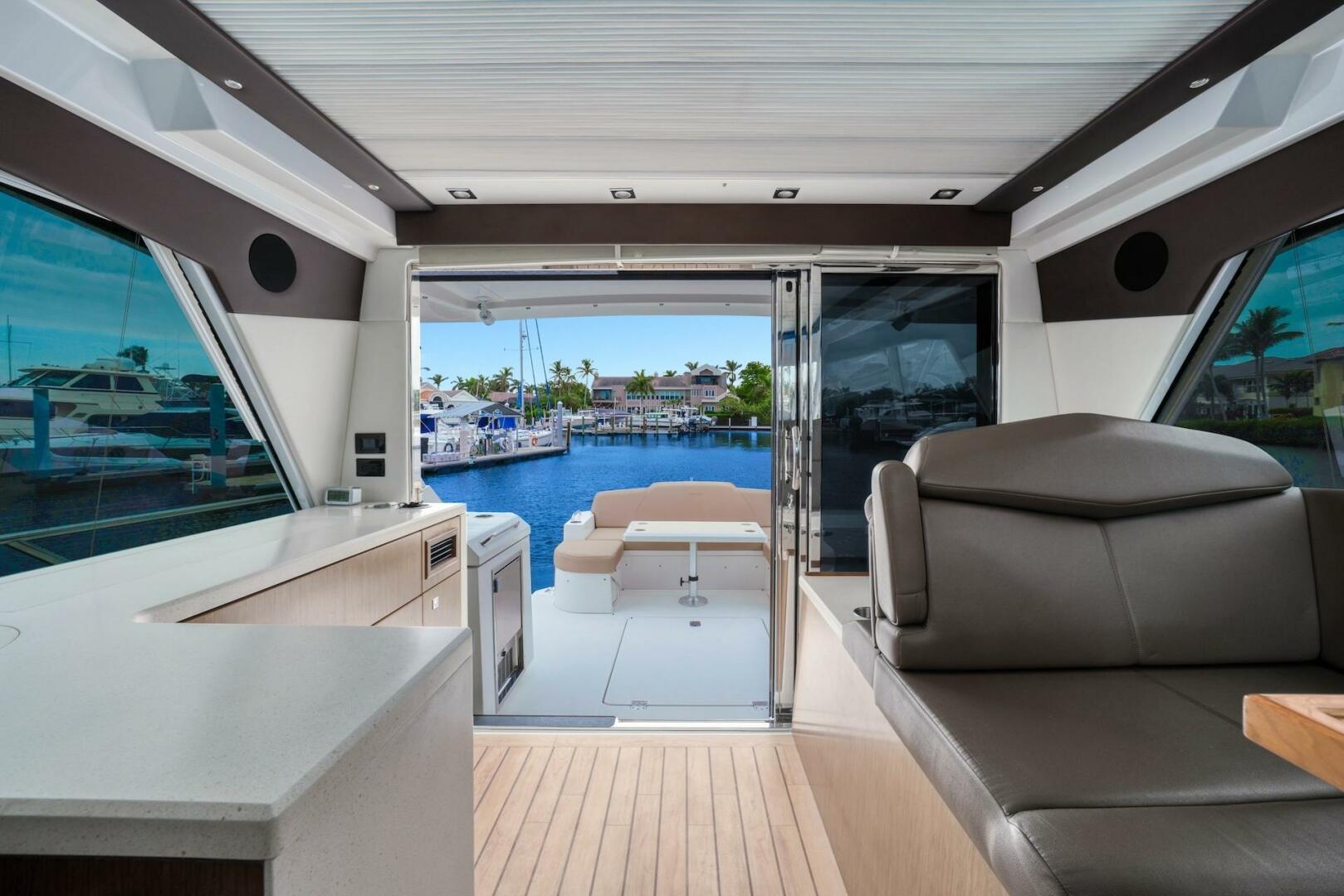 Slide: The Image of 2015 Cruisers Yachts 48 Cantius - Upper Salon & View of Cockpit - 5117038