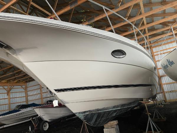 Slide: The Image of 2001 Cruisers Yachts 3470 Express in storage, showcasing sleek design and craftsmanship. - 11
