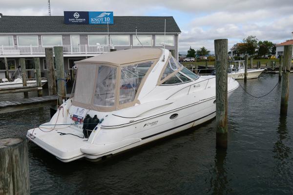 Slide: The Image of 2002 Cruisers Yachts 3470 Express docked at a marina. - 1