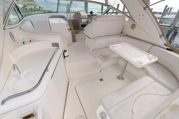 Slide: The Image of 2002 Cruisers Yachts 3470 Express interior with seating and helm station. - 6