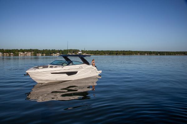 Slide: The Image of 2023 Cruisers Yachts 34 GLS on a calm lake. - 16