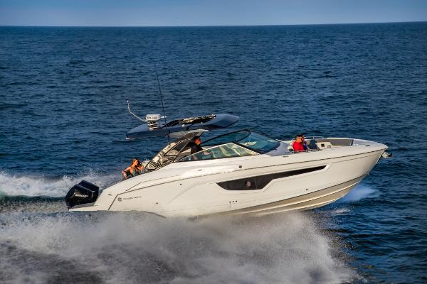 Slide: The Image of 2023 Cruisers Yachts 34 GLS speeding on open water. - 18