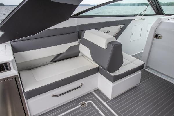 Slide: The Image of 2023 Cruisers Yachts 34 GLS interior seating with modern design and lake view. - 24