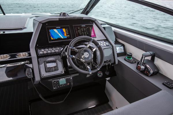 Slide: The Image of 2023 Cruisers Yachts 34 GLS helm with advanced navigation and control systems. - 32