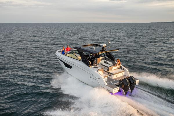 Slide: The Image of 2023 Cruisers Yachts 34 GLS cruising on open water. - 7