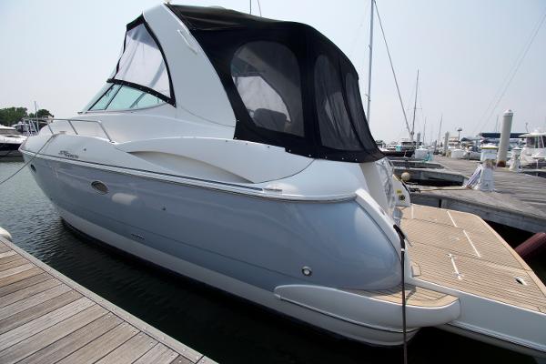 Slide: The Image of 2005 Cruisers Yachts 370 Express docked at marina, rear view. - 1