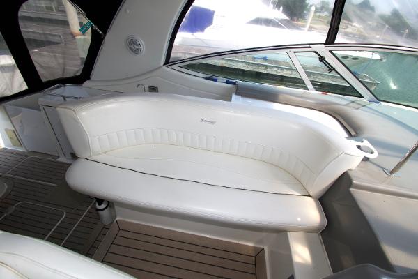 Slide: The Image of 2005 Cruisers Yachts 370 Express interior with white seating and sleek design. - 12
