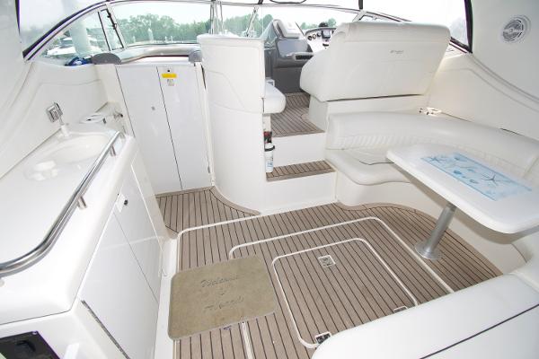 Slide: The Image of Luxurious interior of 2005 Cruisers Yachts 370 Express with elegant seating and wooden flooring. - 8