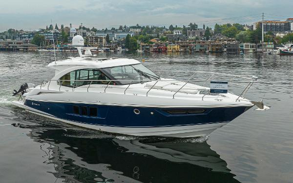 Slide: The Image of 2018 Cruisers Yachts 45 Cantius on a calm lake with cityscape background. - 1
