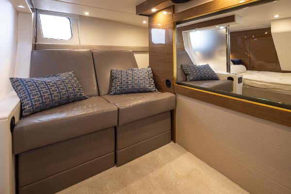 Slide: The Image of 2018 Cruisers Yachts 45 Cantius interior with leather seating and decorative pillows. - 19