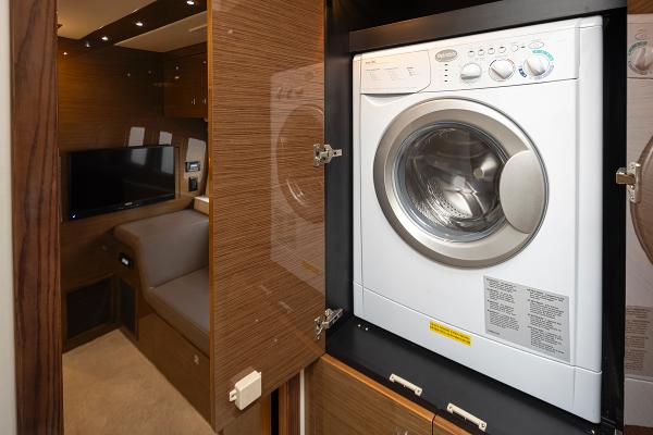 Slide: The Image of 2018 Cruisers Yachts 45 Cantius interior with washer and dryer unit. - 24