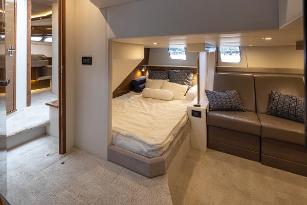 Slide: The Image of 2018 Cruisers Yachts 45 Cantius interior cabin with bed and seating area. - 26