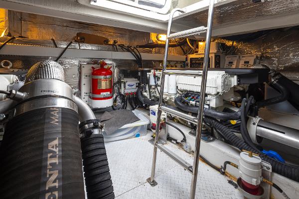 Slide: The Image of Engine room of a 2018 Cruisers Yachts 45 Cantius with equipment and fire extinguisher. - 30