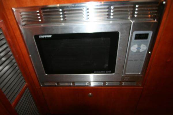Slide: The Image of Built-in microwave in 2008 Cruisers Yachts 460 Express galley. - 23