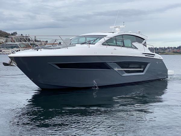 Slide: The Image of 2023 Cruisers Yachts 46 Cantius on calm water, showcasing sleek design and modern features. - 7