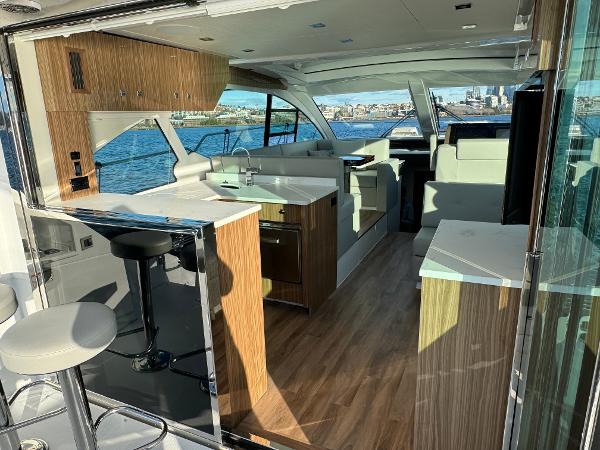 Slide: The Image of Interior of 2024 Cruisers Yachts 50 Cantius with modern kitchen and seating area. - 11