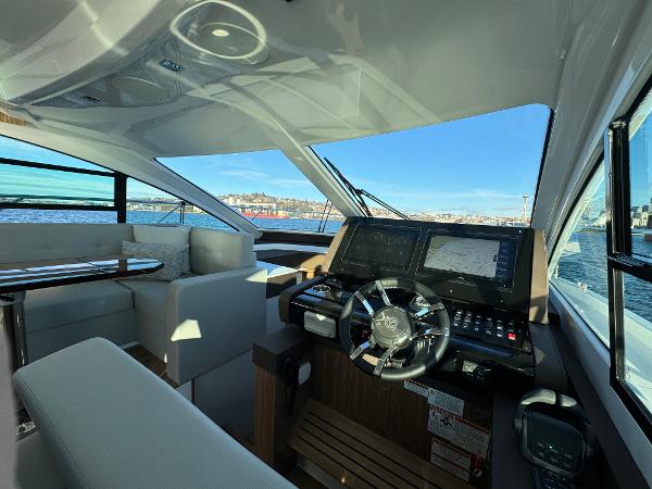 Slide: The Image of Interior helm of 2024 Cruisers Yachts 50 Cantius with panoramic views. - 16