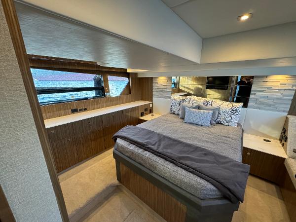 Slide: The Image of Luxurious bedroom interior of 2024 Cruisers Yachts 50 Cantius with modern design and waterfront view. - 22