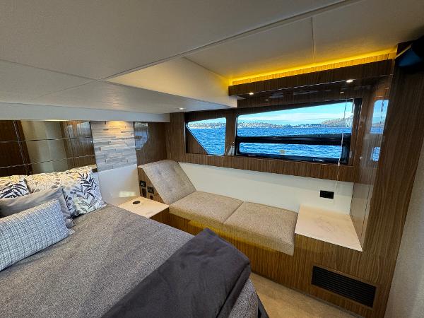 Slide: The Image of Luxurious cabin interior of 2024 Cruisers Yachts 50 Cantius with scenic window view. - 23