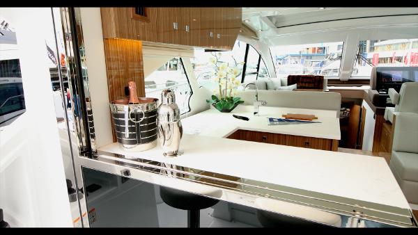 Slide: The Image of Luxurious interior of 2024 Cruisers Yachts 50 Cantius with modern decor and seating area. - 27