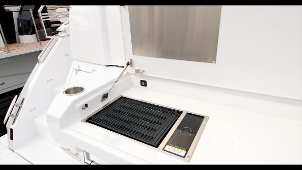Slide: The Image of Outdoor grill station on 2024 Cruisers Yachts 50 Cantius. - 28