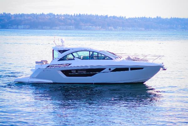 Slide: The Image of 2024 Cruisers Yachts 50 Cantius luxury yacht on calm water. - 3